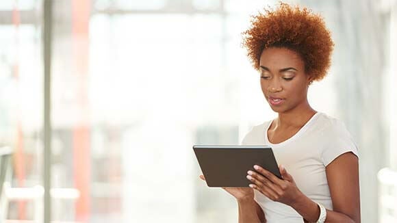 woman standing with ipad woman standing with ipad