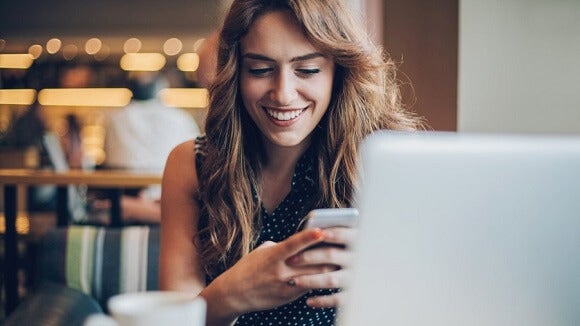 woman smiling on mobile woman smiling on mobile