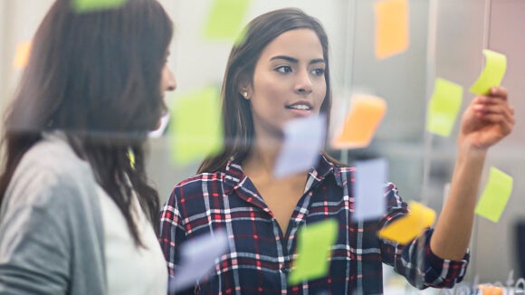 women with sticky notes women with sticky notes
