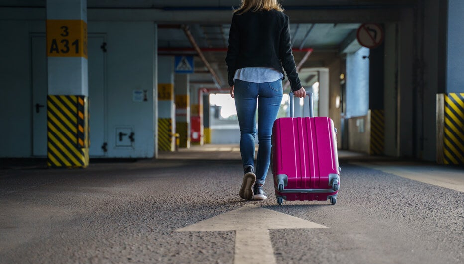 woman walking with luggage