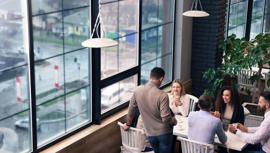 group of people at table with view