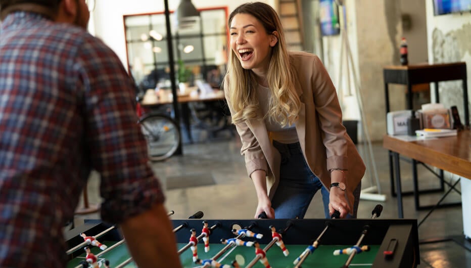 woman playing table football