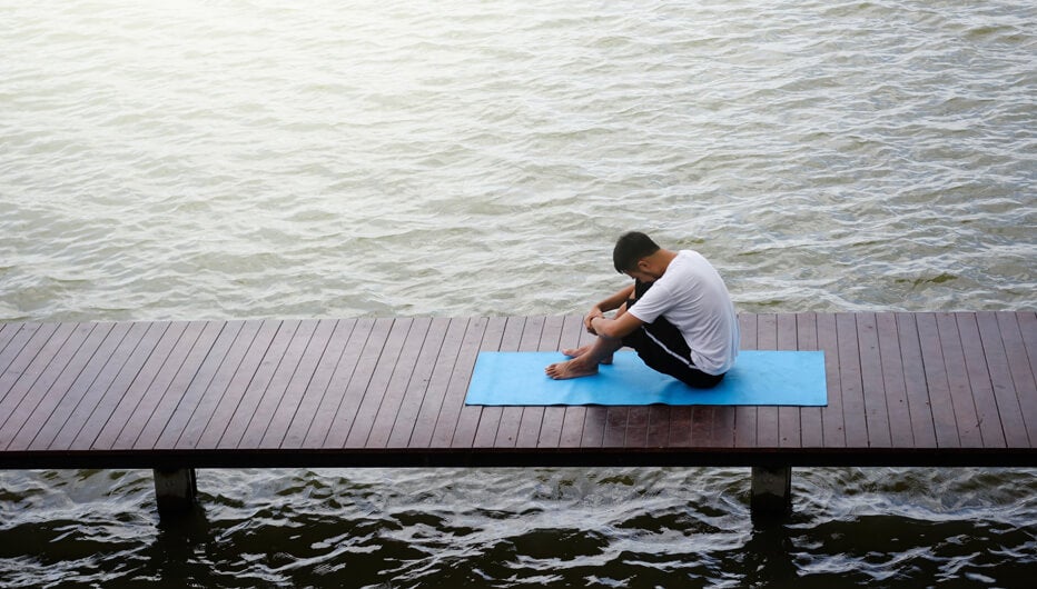 man with yoga mat