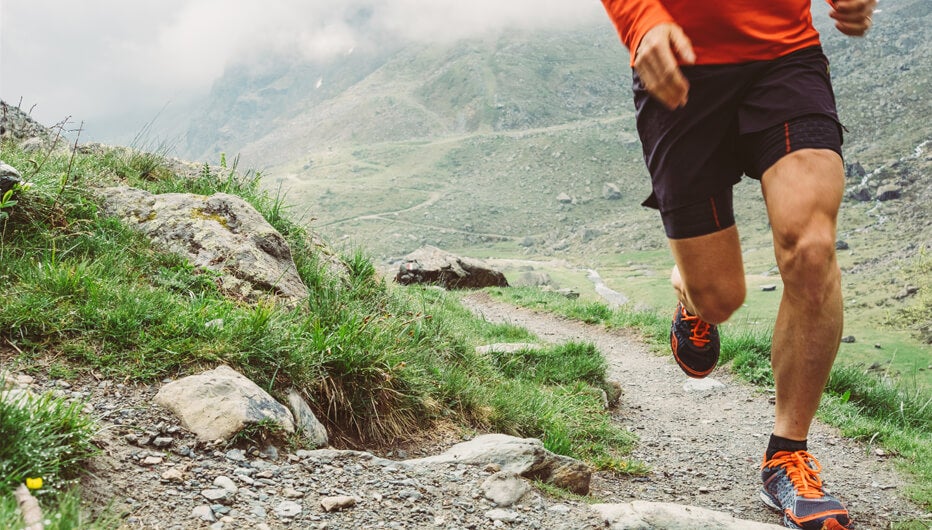 man jogging up hill