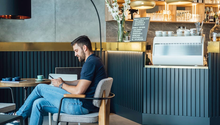 man on phone in coffee shop