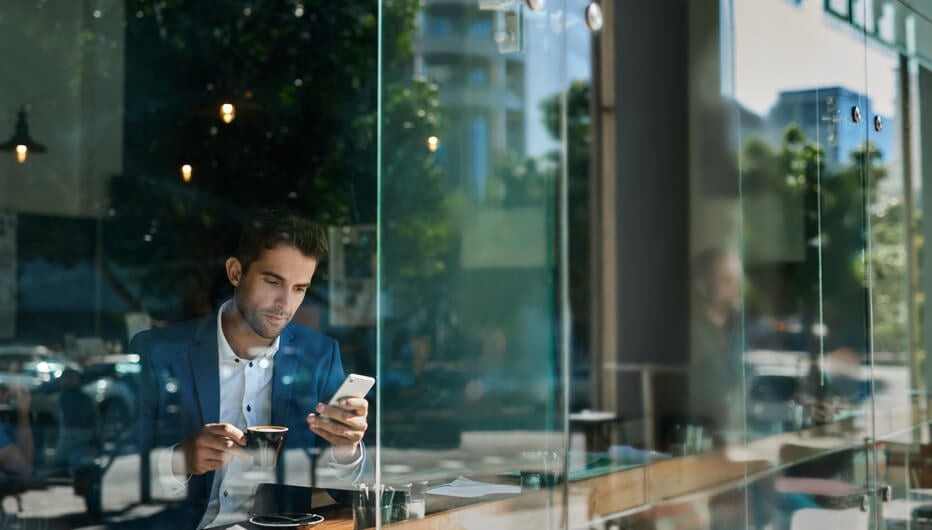 Man on phone in cafe